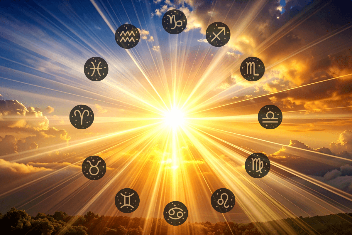 - Tracy Quinlan The twelve zodiac sign symbols arranged in a circle around a bright sunburst against a golden sky